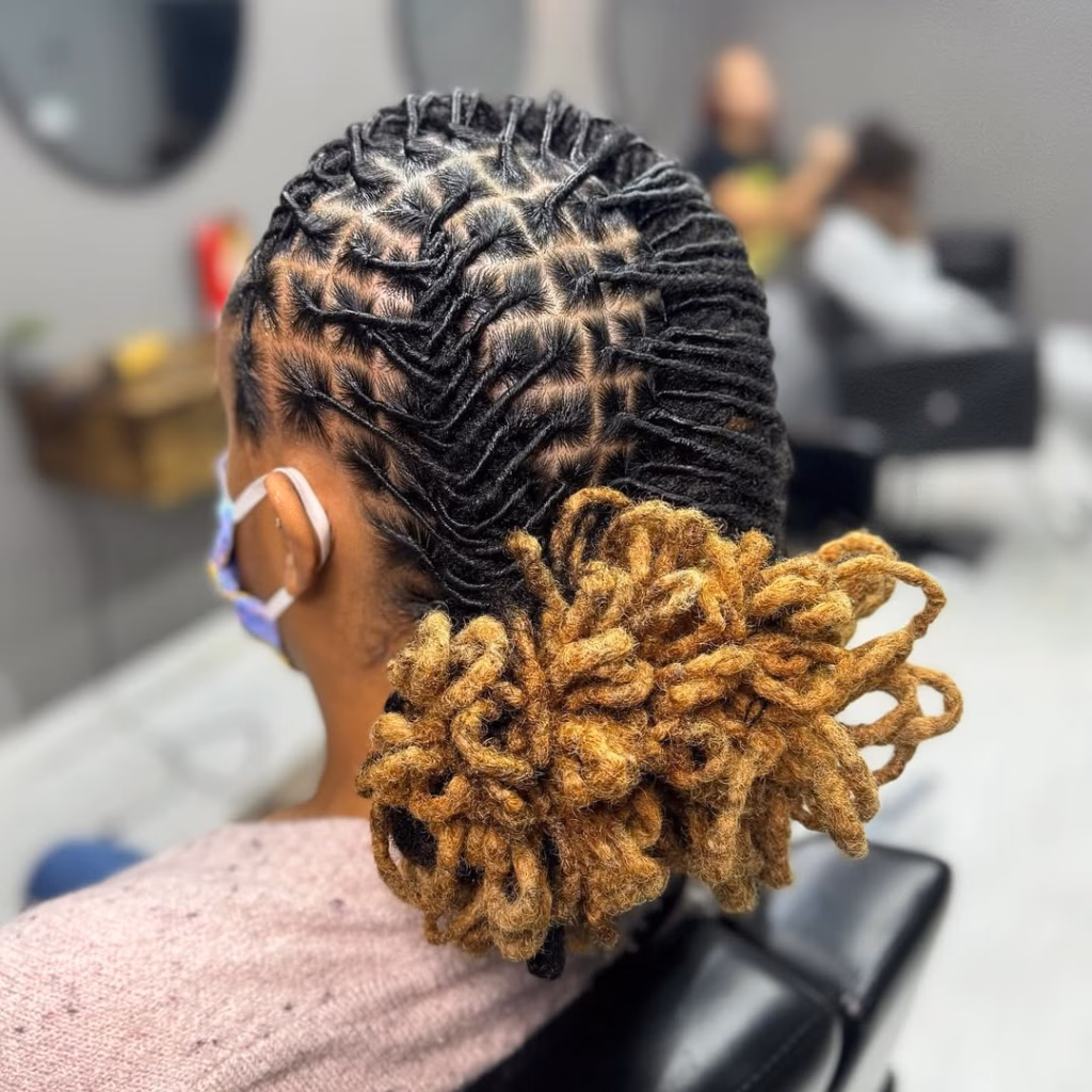 Black Flat-Laid Locs Updo with Golden Amber Looped Bun