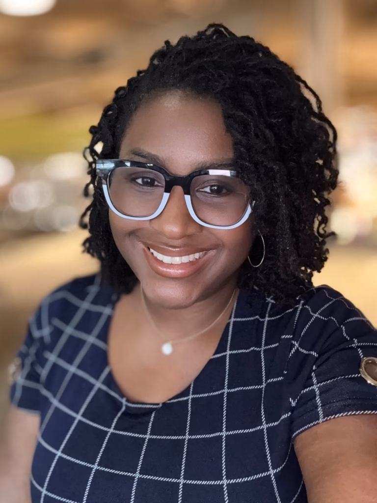 Curly Ended Locs Worn Down With Two-Tone Frames