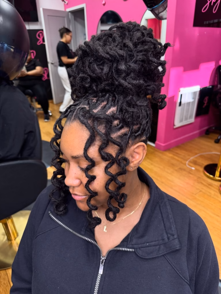 High Bun With Curly Loc Tendrils