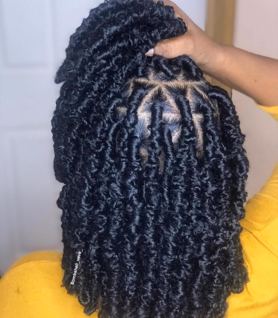 Jet Black Fluffy Coil Locs at Shoulder Length