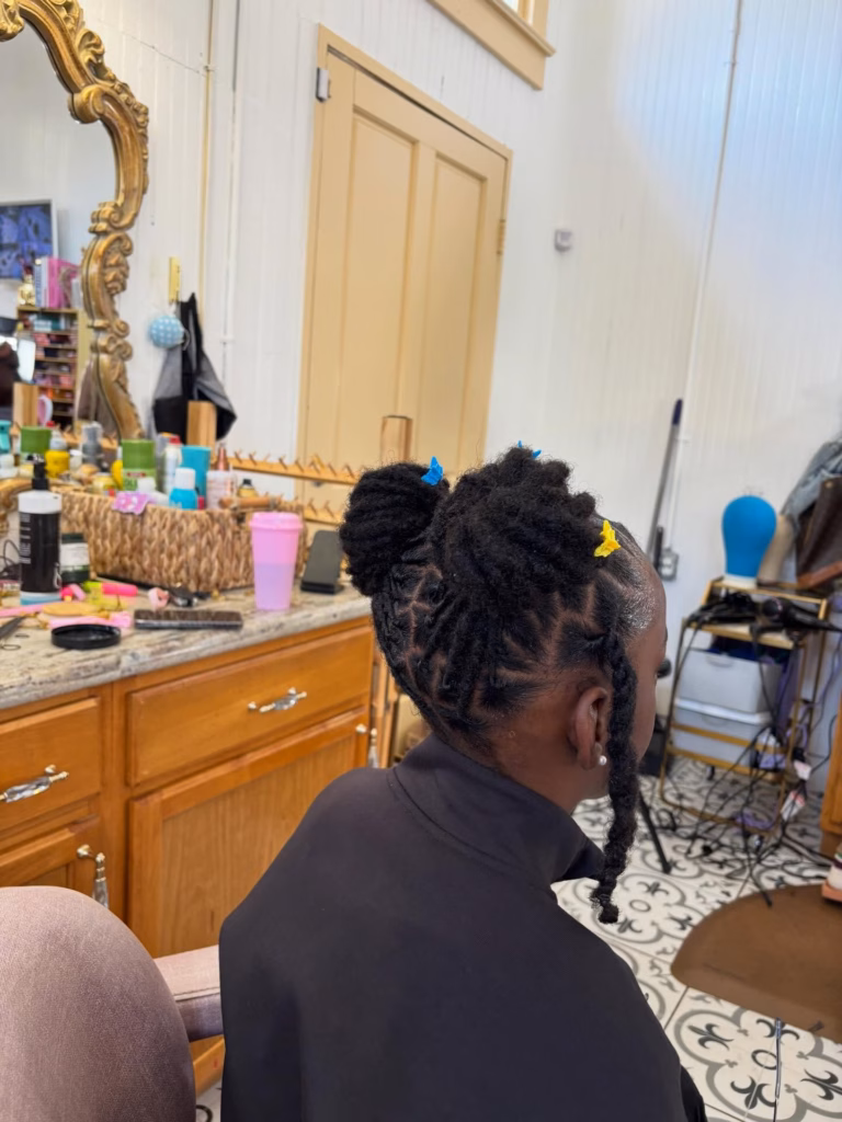 Loc Bun with Butterfly Clips and Side Tails