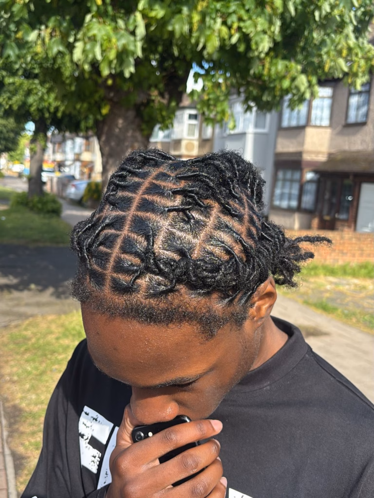 Older Teen's Short Locs with Large Square Parts and Natural Edges