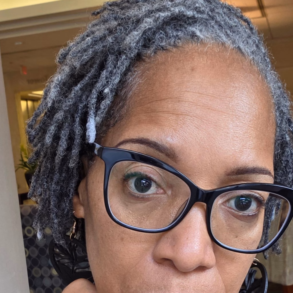 Short Grey Locs with White Highlight Strand