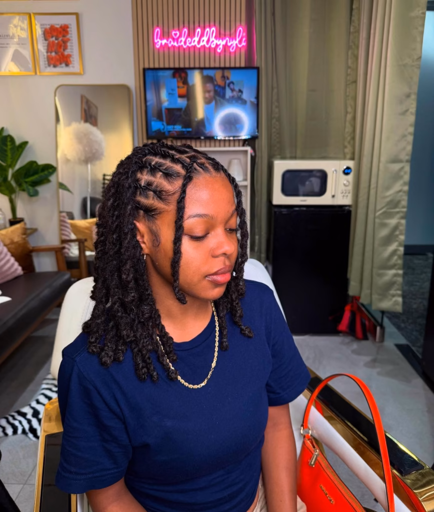 Shoulder Length Loc Bob with Zigzag Parts and Curly Ends