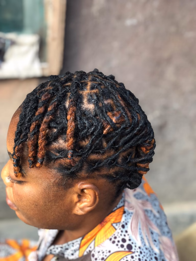 Auburn Highlighted Locs with Cross Parts