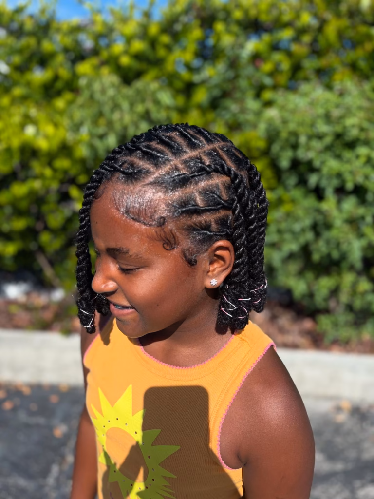 Flat Twisted Crown With Short Hanging Locs and String Accents
