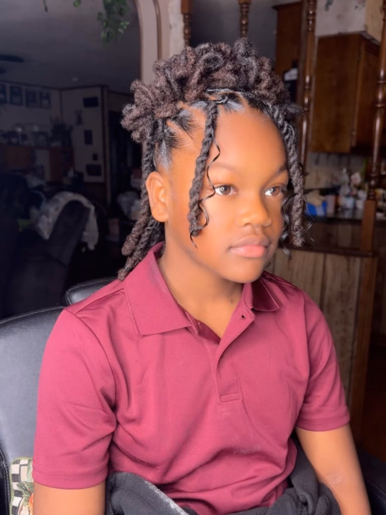 Half-Up Loc Puff With Curly Loose Tendrils Framing the Face