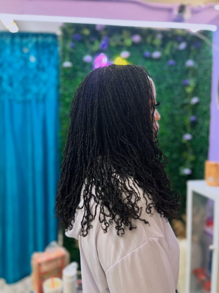 Shoulder-Length Sisterlocks With Defined Spiral Curl Ends Worn Loose