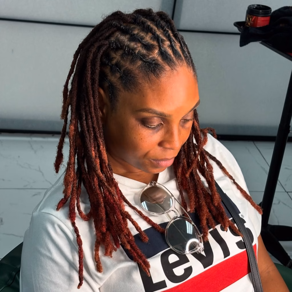 Deep Auburn Locs with Crown Parting and Face-Framing Layers