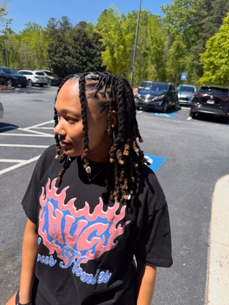 Deep Side-Parted Locs with Cowrie Shell and Bead Accents