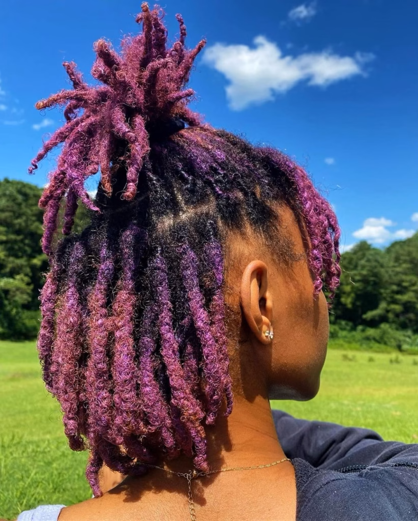 Purple Locs Styled into a Half-Up Faux Hawk