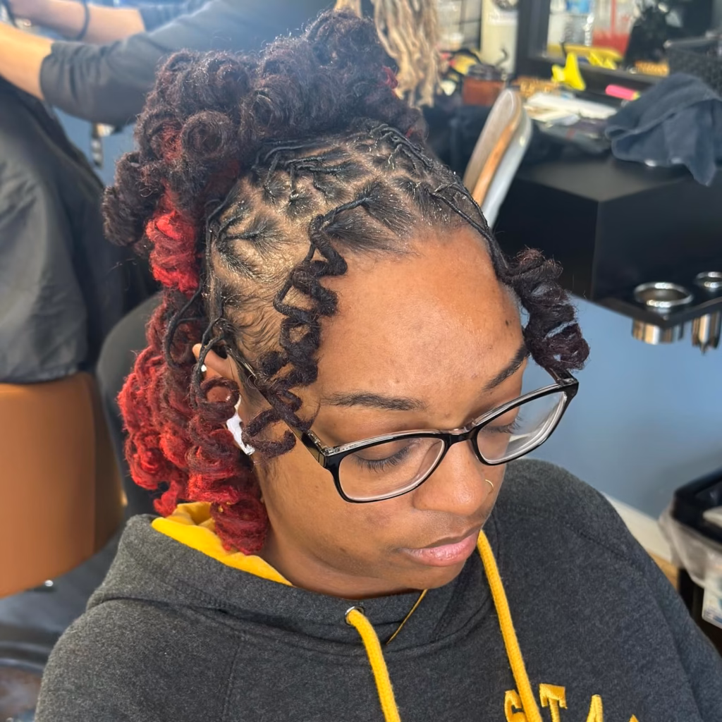 Spiral Curled Half Up with Bold Red Highlights